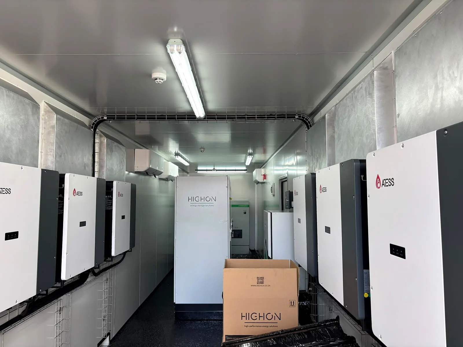 Row of ATESS hybrid inverters mounted inside the container